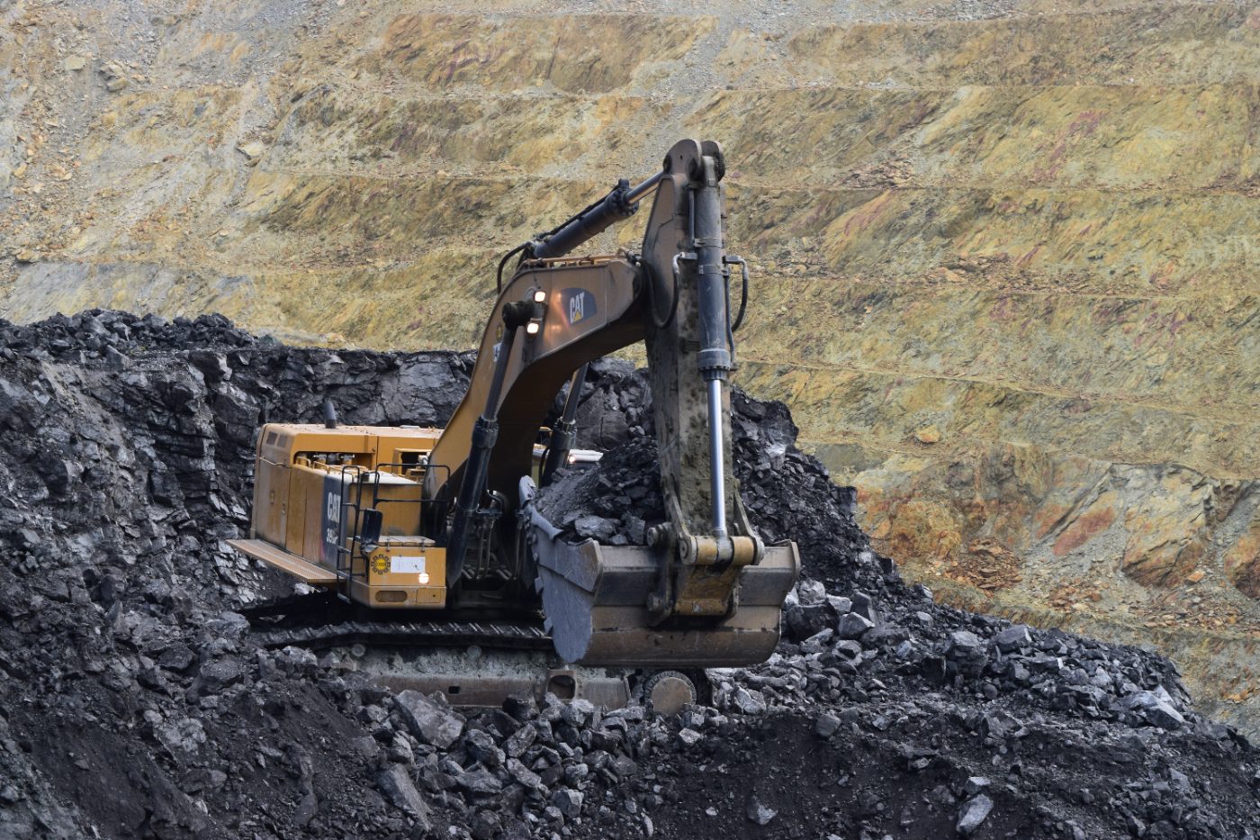 Excavator loading on bench
